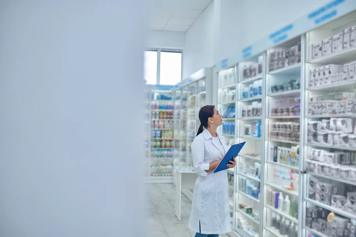 A pharmacist checking stock against quality standards